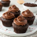 Delicious homemade chocolate cupcakes with creamy frosting and chocolate shavings"